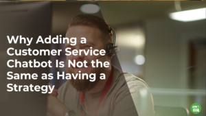 blog header. The background image is of a smiling man working customer support. The text on the image reads, "Why Adding a Customer Service Chatbot Is Not the Same as Having a Strategy"